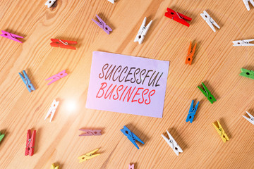 Text sign showing Successful Business. Business photo showcasing Achievement of goals within a specified period of time Colored clothespin papers empty reminder wooden floor background office