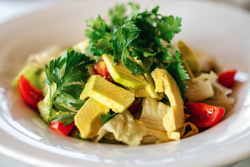 A delicious avocado salad is served in a elegance restaurant or hotel