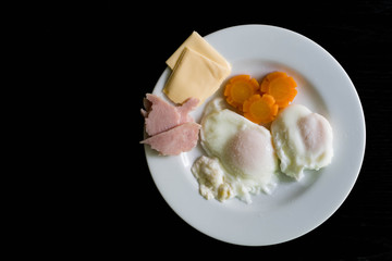 Breakfast set on black table.