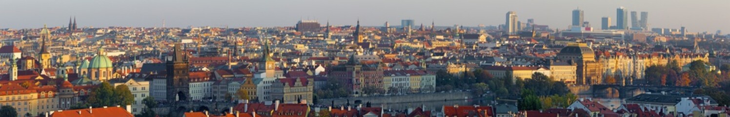 Fototapeta na wymiar Prague - The panorama of the city with the Charles bridge and the Old Town in evening light.