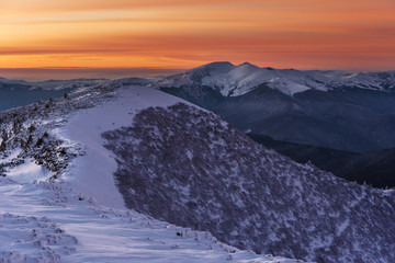 Fototapeta na wymiar Mountain winter landscape in the Ukrainian Carpathians on the background of the sunset. 
