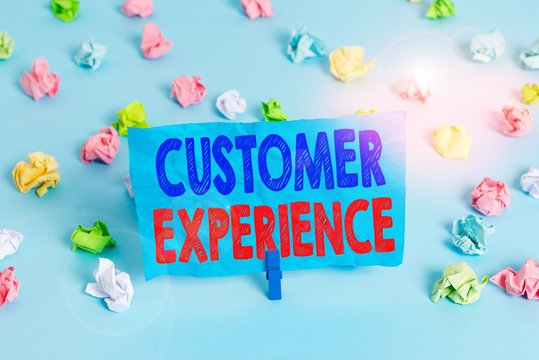 Word writing text Customer Experience. Business photo showcasing product of an interaction between a client and customer Colored crumpled papers empty reminder blue floor background clothespin