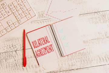 Conceptual hand writing showing Bilateral Agreement. Concept meaning Legal obligations to...