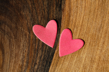 Obraz premium valentine's day. Red hearts on a wooden background.