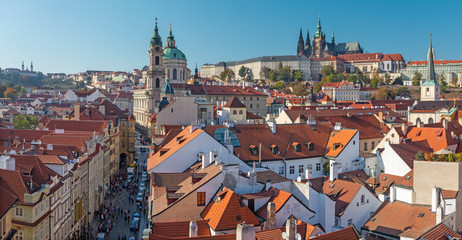 Naklejka na ściany i meble Prague - The roofs of Mala Strana with the St. Nicholas church, Castle and the Cathedral.