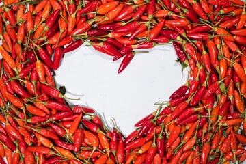 Fotobehang Chili Pepers Fresh organic vegetable red hot chili pepper heart shape  © olga pink