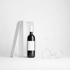 Wine bottle near open box and wine glasses, on white background. Label clipping path included. 3D render