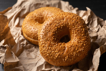 Sesame bagels on dark background