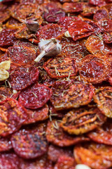 Tasty dried tomatoes as background. Top view