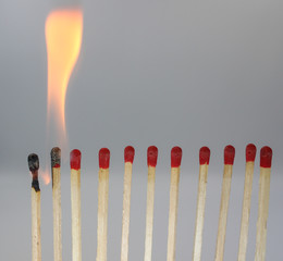 group of matches on black background
