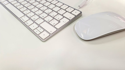 Light keyboard and mouse. Business concept. Background.