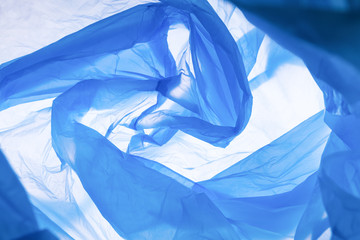 Pattern of blue trash bag over white background