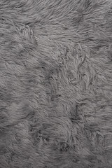 close-up natural grey wool rug background texture.