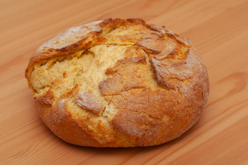 Delicious fresh bread on a wooden board