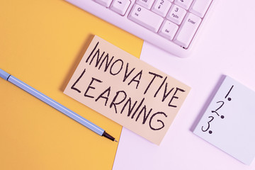 Writing note showing Innovative Learning. Business concept for Interdisciplinary teaching that stirs analytic thinking Paper with copy space and keyboard above orange background table