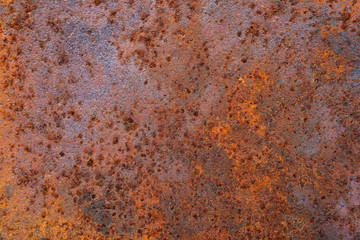 The metal surface is filled with rust that is reddish brown. .Gives a retro and vintage feel.