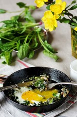 shakshuka with spinach or fried eggs. Green Shakshuka. Cook in Israel. Paleo. Keto diet dish. 