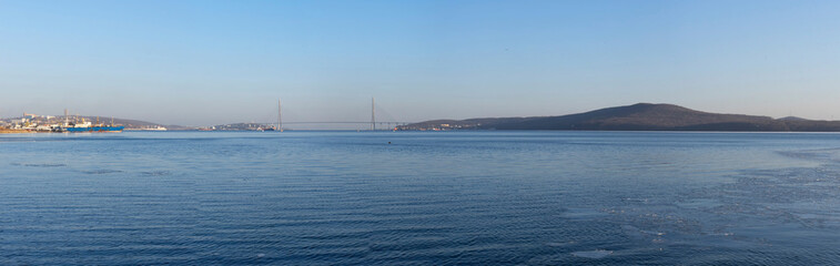 Panorama of the sea landscape with a view of the Russian bridge.