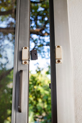 Broken security magnetic lock contact for mosquito wire screen window, Repair Room concept