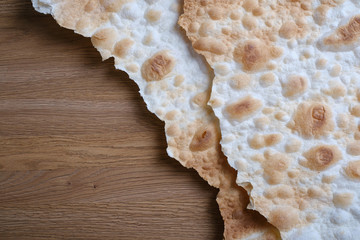 Lavash texture. Tradition bread  lavash on wooden background. Copy space