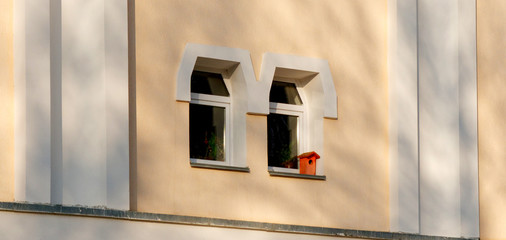 birdhouse on the window of a residential building