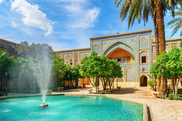 Amazing fountain in the middle of traditional Persian courtyard