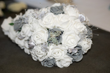 wedding bouquet of white rose with butterfly detail