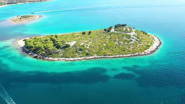 Beautiful blue seascape, islands on Adriatic sea in Croatia near Pakostane, drone circle aerial footage