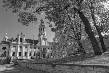 PRAGUE, CZECH REPUBLIC - OCTOBER 14, 2018: The Loreto baroque church and autumn tree.