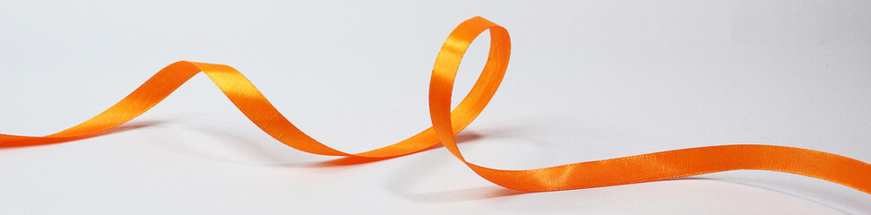 Orange ribbon isolated on white background