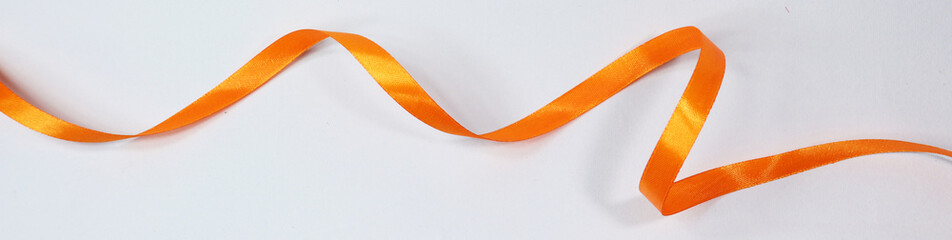 Orange ribbon isolated on white background