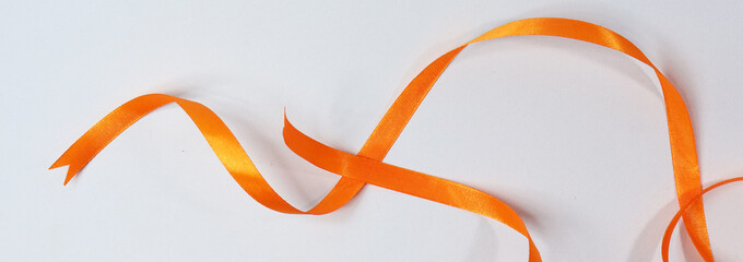 Orange ribbon isolated on white background