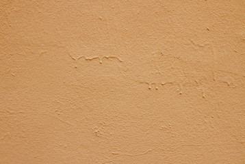 Fototapeta na wymiar Old peeling paint on the wall. Brown abstract background. Beautiful brown textured stucco on the wall. Background from brown stucco. Background from brown stucco.