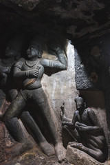 The ancient 7th century sculptures inside the dark, monolithic rock cut caves of Undavalli near the city of Vijayawada in Andhra Pradesh.