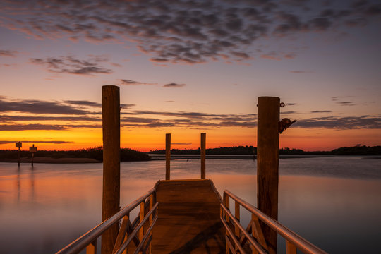 A Motion-blur Image Of A Boat Launch, Located In Daytona Beach, Florida At Sunrise On The Halifax River. 