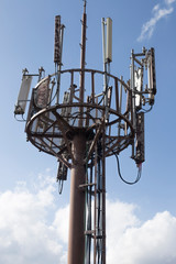 Broadcast relay station antennas at rising. Telecommunications towers.