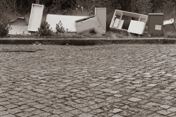Illegal disposal of bulky waste, bulky waste on the street, pollution in everyday life, black and...