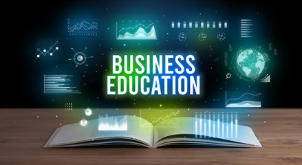 BUSINESS EDUCATION inscription coming out from an open book, creative business concept