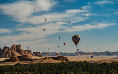 Winter at Tantora Hot Air Balloon Festival over Mada'in Saleh (Hegra) ancient site, Al Ula, Saudi...