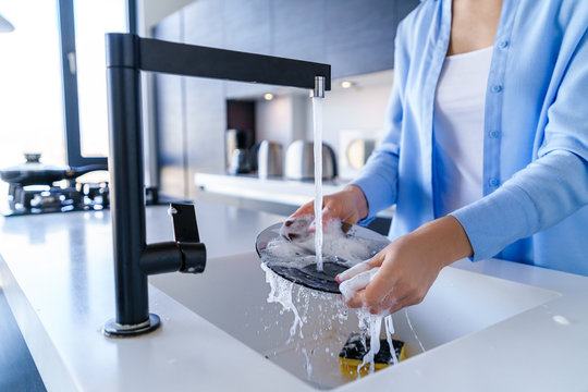 Cleaning Woman Dishwashing During Housework