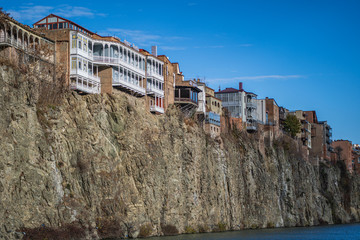 Houses with wooden carved balconies on the edge of a cliff above the river Kura in the historic city center of Tbilisi, Georgia