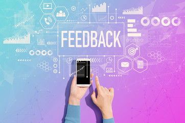 Feedback concept with person using a white smartphone