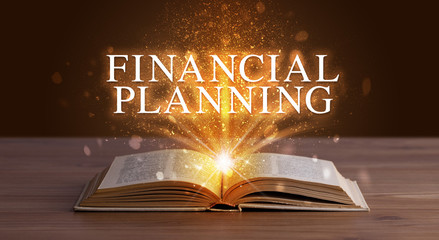 FINANCIAL PLANNING inscription coming out from an open book, educational concept