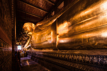 famous golden reclining buddha statue at wat pho bangkok thailand - obrazy, fototapety, plakaty