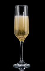a golden ring in a glass with champagne, many bubbles, like a marriage proposal