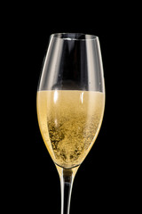 a golden ring in a glass with champagne, many bubbles, like a marriage proposal