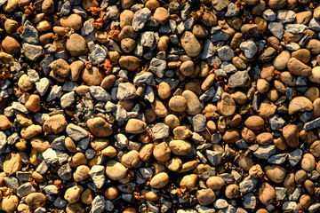 Background texture of stone wall. abstract background with dry round reeble stones.