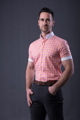 Obraz premium man in a red shirt and dress pants