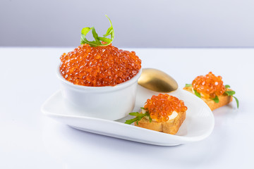 red caviar on a white plate. snack in canapes