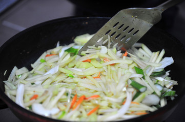 Fry potatoes in a frying pan